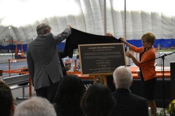 President Laura Casamento reveals a plaque dedicating the track as the  Lotis Howland Track.